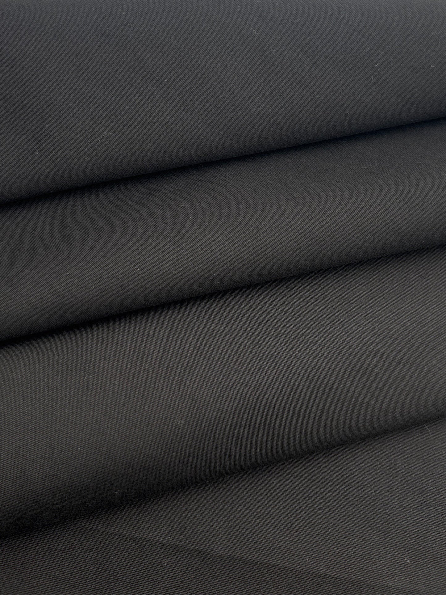 A close-up of folded black fabric 