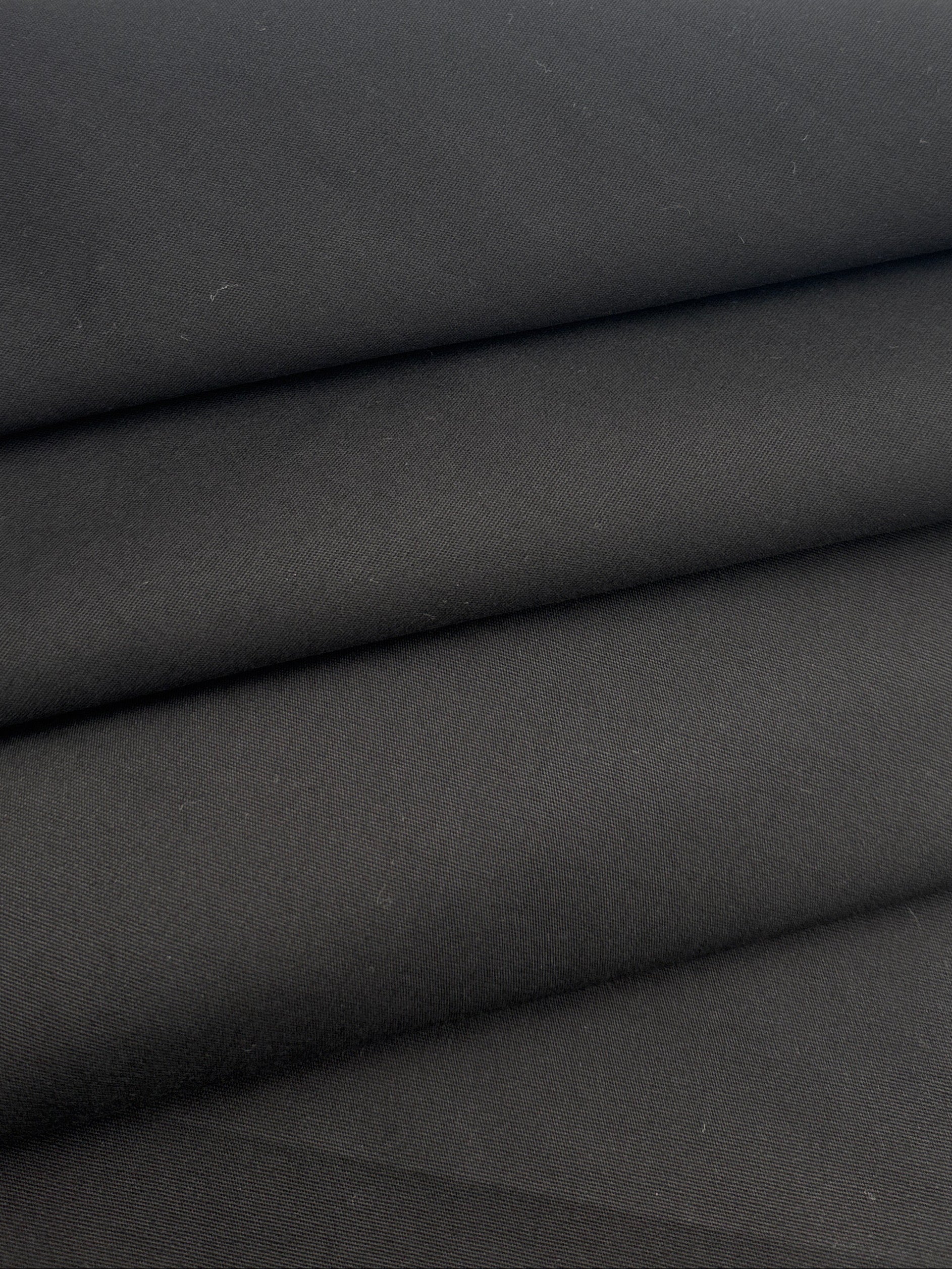 A close-up of folded black fabric 