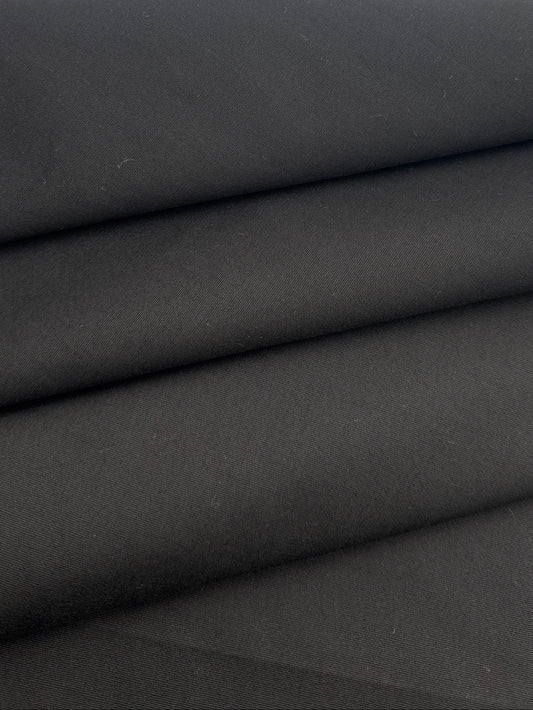 A close-up of folded black fabric 